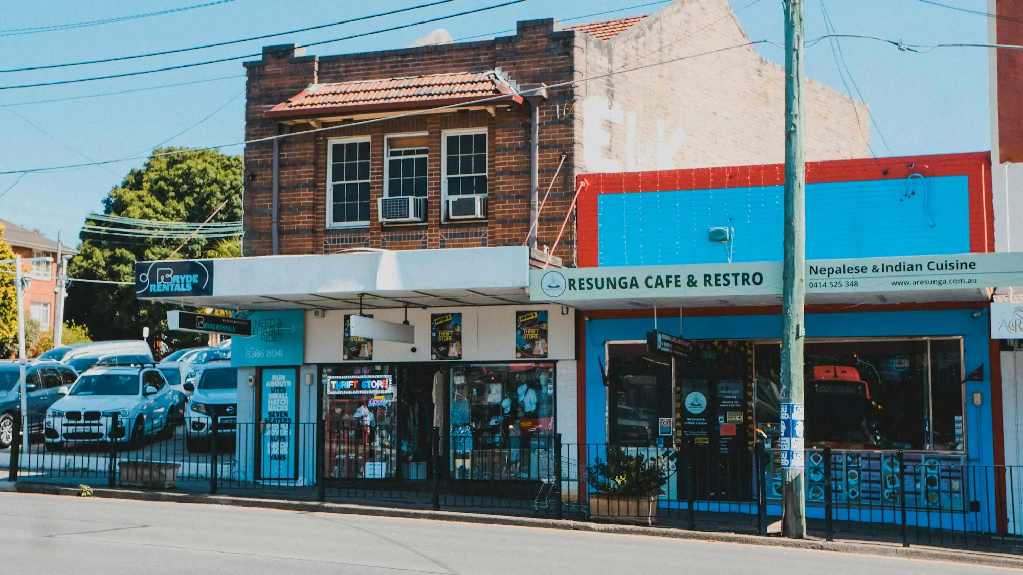 Row of shops with signage in West Ryde, Sydney