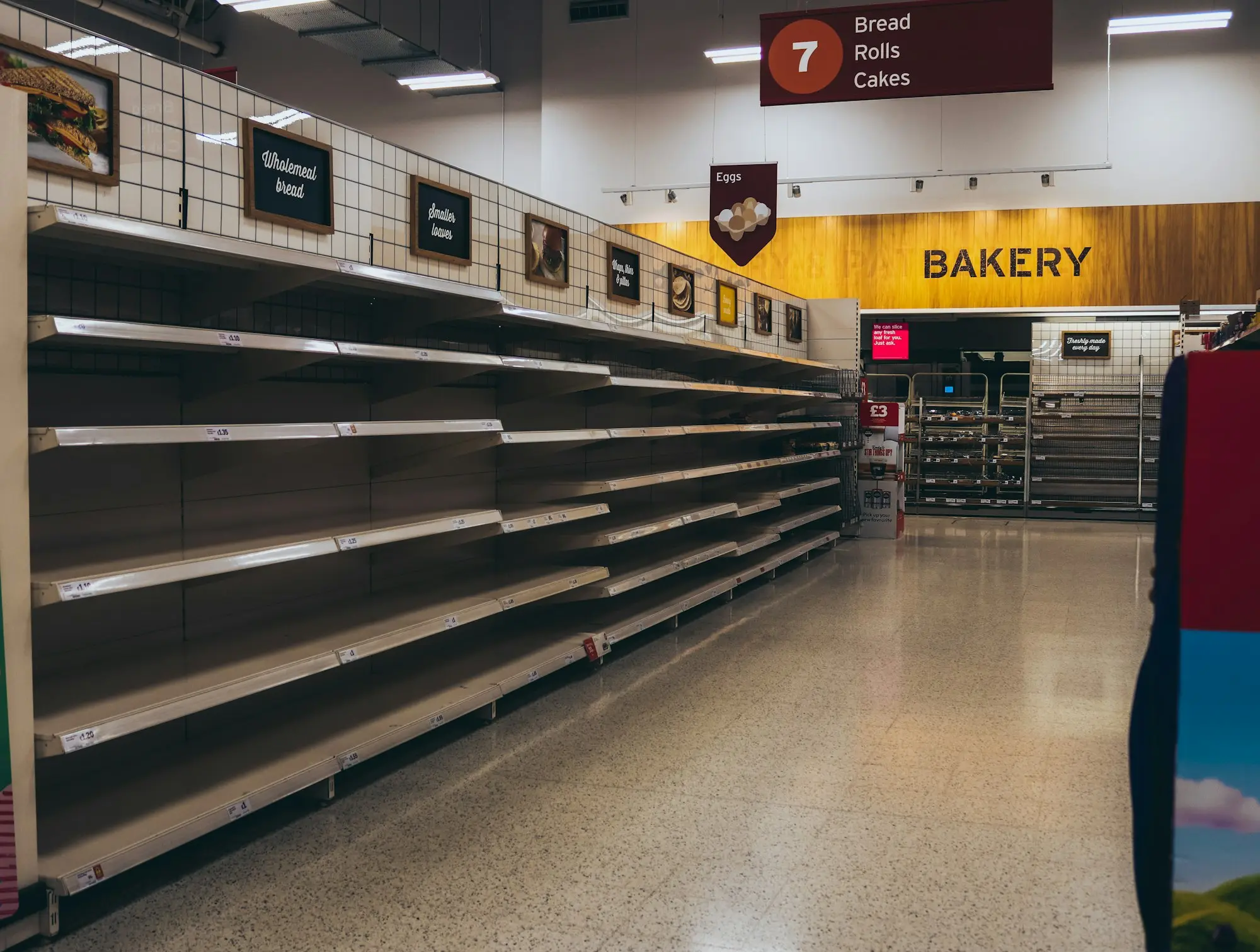 Empty shelves in a store waiting for a new tenant